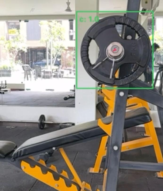 Our AI model detects barbells accurately in a cluttered gym setting